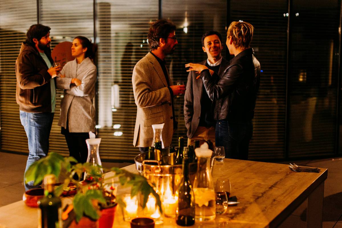 Professional shaking hands at career networking events London with City skyline backdrop